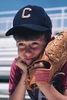 Photo of boy with baseball glove looking sad